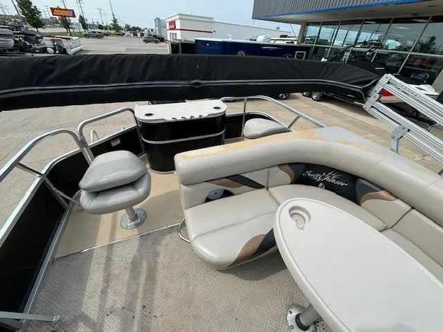 Slide: The Image of 2012 SunChaser 8522 C-N-F pontoon boat interior with seating and table. - 20