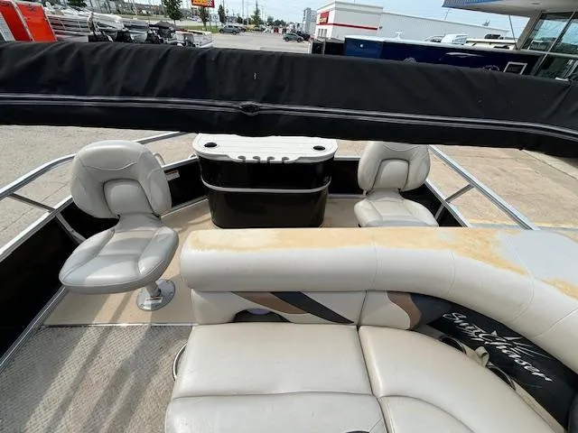Slide: The Image of 2012 SunChaser 8522 C-N-F pontoon boat interior with seating and console. - 21