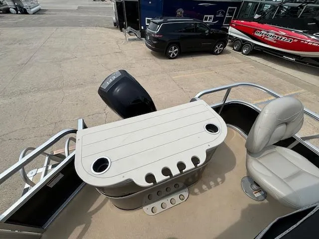 Slide: The Image of 2012 SunChaser 8522 C-N-F pontoon boat with seating and table on deck. - 22