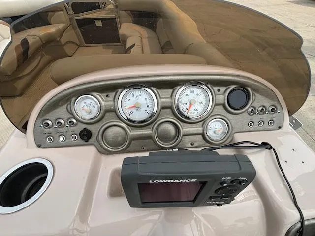 Slide: The Image of Dashboard of 2012 SunChaser 8522 C-N-F boat with gauges and Lowrance device. - 28