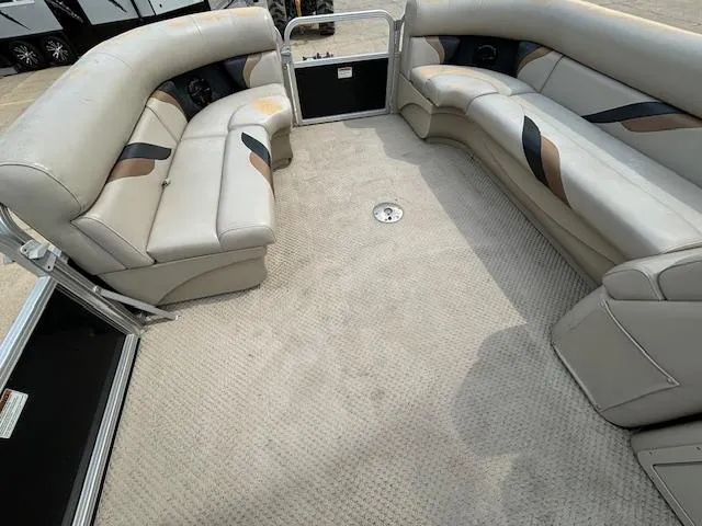 Slide: The Image of Interior of 2012 SunChaser 8522 C-N-F pontoon boat with beige seating and carpet. - 31