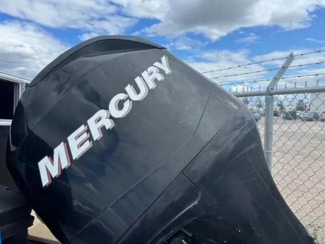 Slide: The Image of Mercury outboard motor on 2012 SunChaser 8522 C-N-F, against a cloudy sky backdrop. - 5