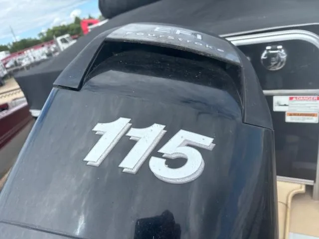 Slide: The Image of Close-up of a 2012 SunChaser 8522 C-N-F boat engine with "115" marking. - 6