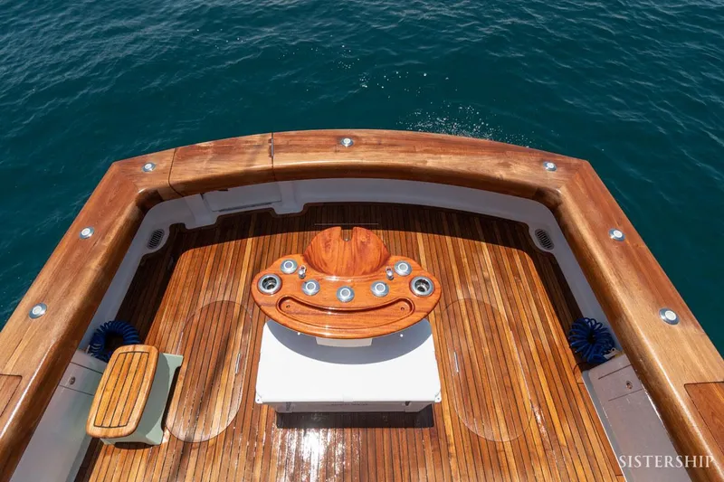 Slide: The Image of Maverick Yachts Costa Rica 45 Sportfish 2025, elegant teak deck, ocean backdrop. - 10