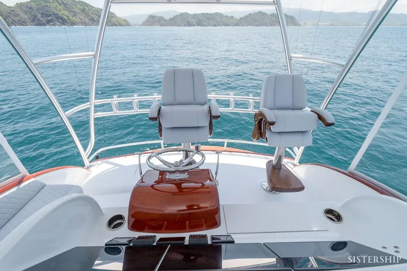 Slide: The Image of Maverick Yachts Costa Rica 45 Sportfish 2025 helm with ocean view and luxury seating. - 8