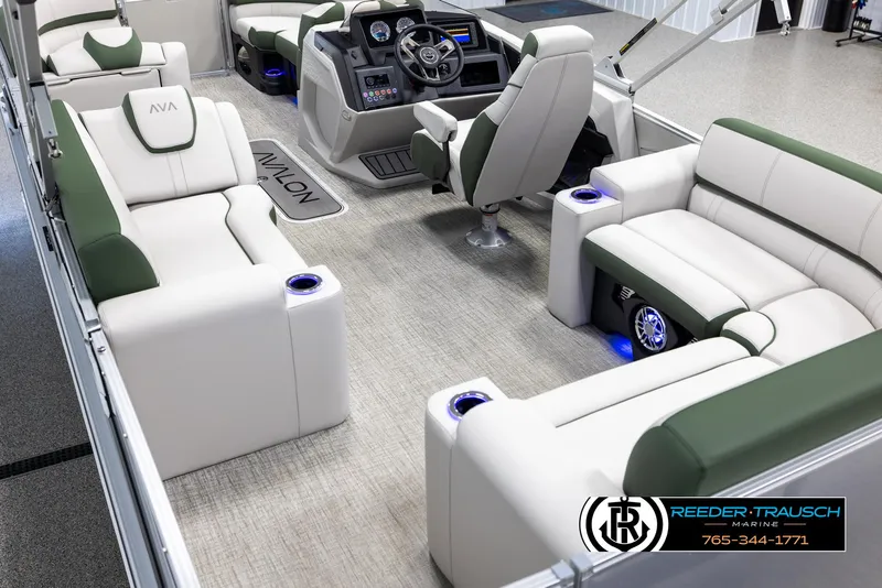 Slide: The Image of 2025 Avalon Catalina EL boat interior with plush seating and modern dashboard. - 11