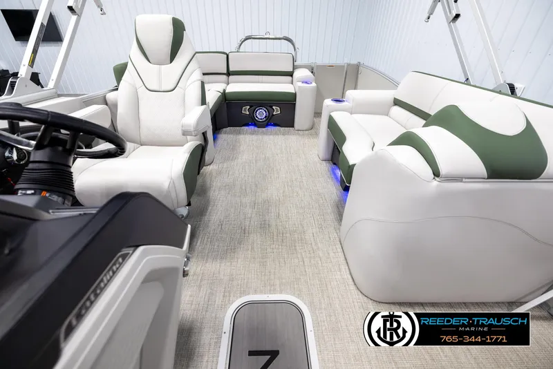 Slide: The Image of 2025 Avalon Catalina EL boat interior with plush seating and modern dashboard. - 14