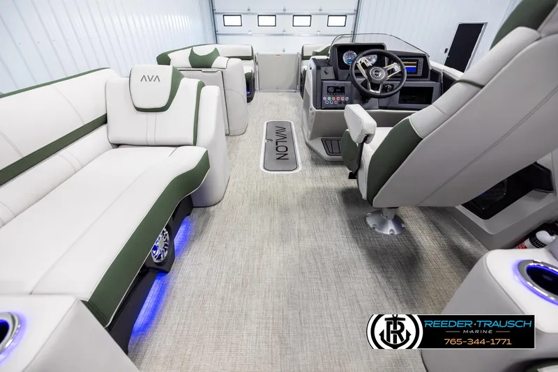 Slide: The Image of 2025 Avalon Catalina EL boat interior with plush seating and modern dashboard. - 17