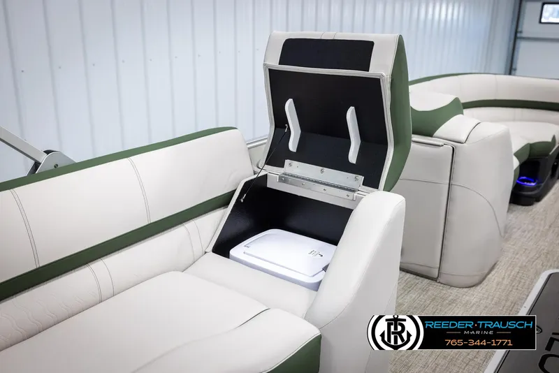 Slide: The Image of 2025 Avalon Catalina EL boat interior with storage compartment open, showcasing sleek seating design. - 24