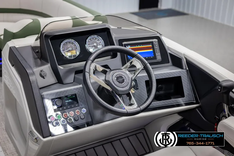 Slide: The Image of 2025 Avalon Catalina EL boat dashboard with steering wheel and digital displays. - 26