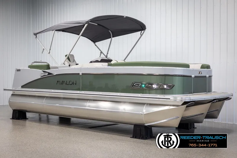 Slide: The Image of 2025 Avalon Catalina EL pontoon boat with canopy in showroom. - 3