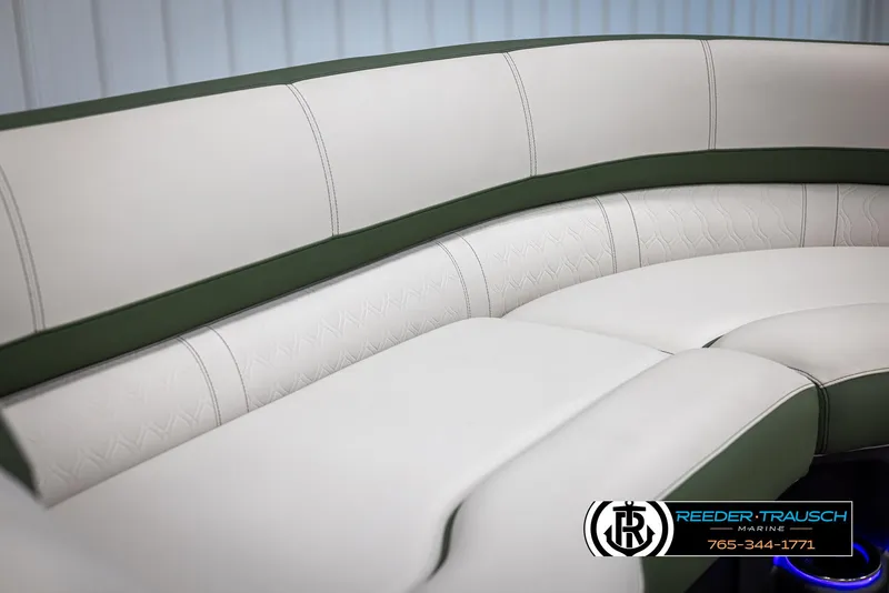 Slide: The Image of Luxurious seating in 2025 Avalon Catalina EL boat, featuring elegant green and white upholstery. - 32