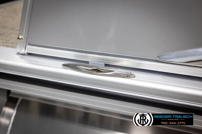 Slide: The Image of 2025 Avalon Catalina EL boat detail with sleek metal finish and Reeder-Trausch Marine logo. - 48