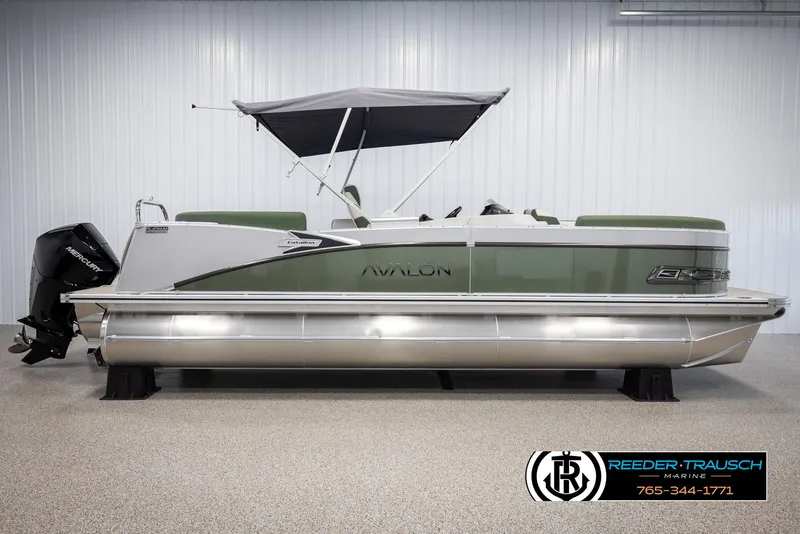 Slide: The Image of 2025 Avalon Catalina EL pontoon boat with canopy in showroom. - 5