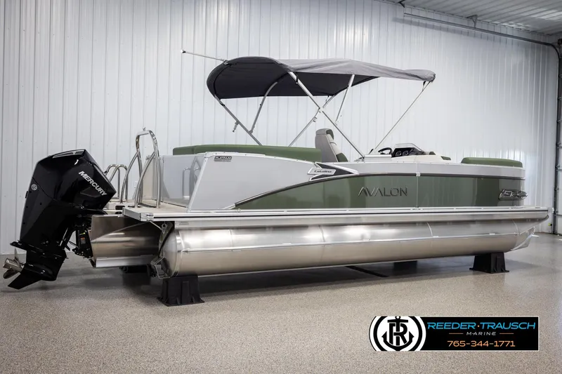 Slide: The Image of 2025 Avalon Catalina EL pontoon boat with canopy in showroom. - 6