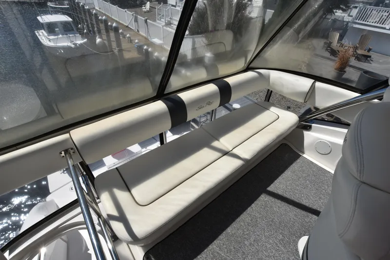 Slide: The Image of Interior view of 2006 Sea Ray 58 Sedan Bridge yacht with cushioned seating. - 12