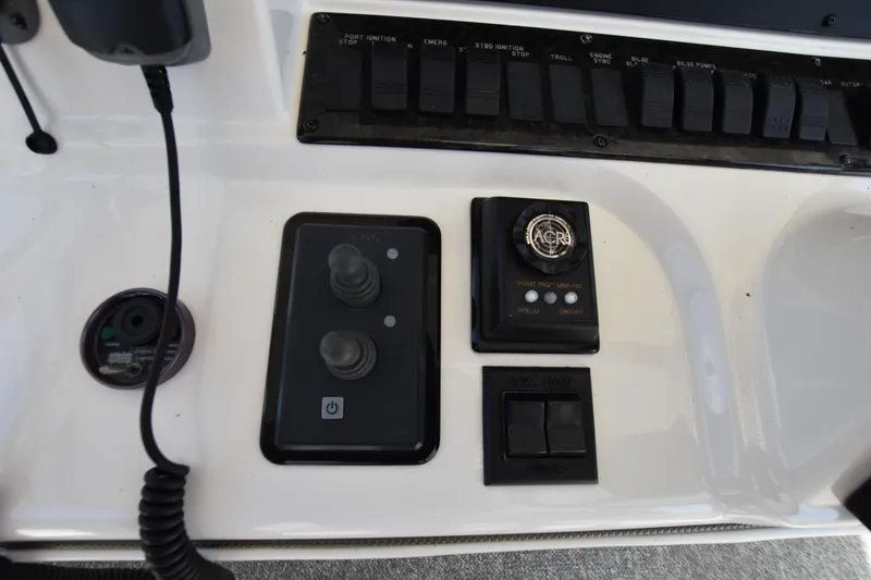 Slide: The Image of Control panel of 2006 Sea Ray 58 Sedan Bridge yacht with switches and dials. - 17