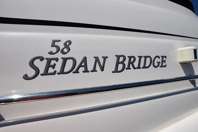 Slide: The Image of Close-up of 2006 Sea Ray 58 Sedan Bridge yacht nameplate. - 26