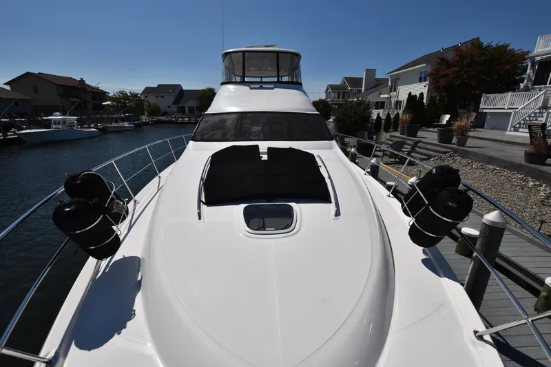 Slide: The Image of 2006 Sea Ray 58 Sedan Bridge yacht docked at marina. - 27