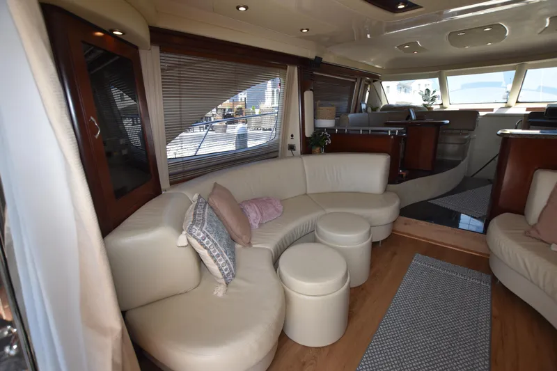 Slide: The Image of Luxurious interior of 2006 Sea Ray 58 Sedan Bridge yacht with plush seating. - 33