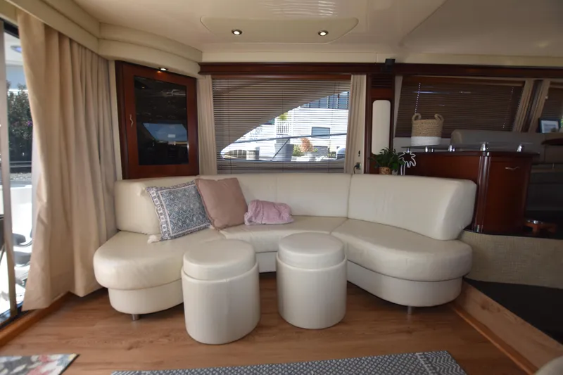 Slide: The Image of Luxurious interior of 2006 Sea Ray 58 Sedan Bridge yacht with plush seating. - 36