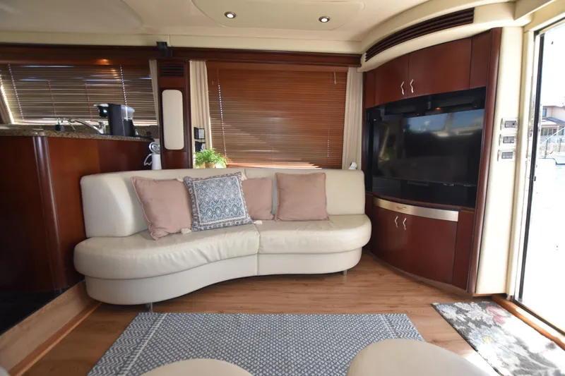 Slide: The Image of Luxurious 2006 Sea Ray 58 Sedan Bridge interior with elegant seating and entertainment area. - 37