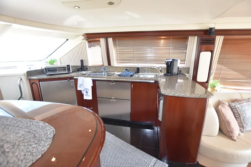 Slide: The Image of Luxurious kitchen interior of 2006 Sea Ray 58 Sedan Bridge yacht with modern amenities. - 40