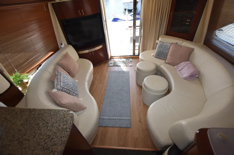 Slide: The Image of Luxurious interior of 2006 Sea Ray 58 Sedan Bridge yacht with plush seating and elegant decor. - 42