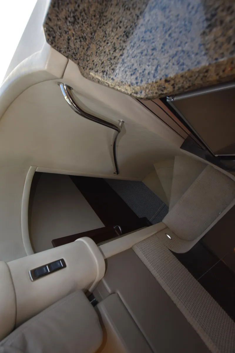 Slide: The Image of Interior staircase of 2006 Sea Ray 58 Sedan Bridge yacht with granite countertop. - 46