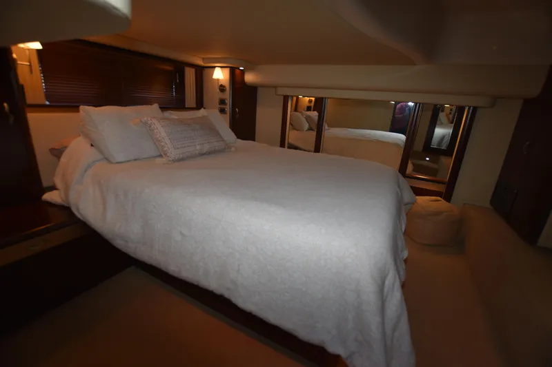 Slide: The Image of Luxurious bedroom interior of 2006 Sea Ray 58 Sedan Bridge yacht. - 48