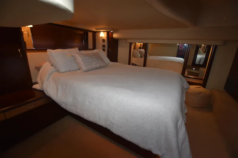 Slide: The Image of Luxurious bedroom interior of 2006 Sea Ray 58 Sedan Bridge yacht. - 49