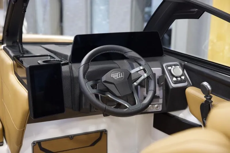 Slide: The Image of 2025 Malibu 23 LSV boat interior with modern steering and dashboard. - 13