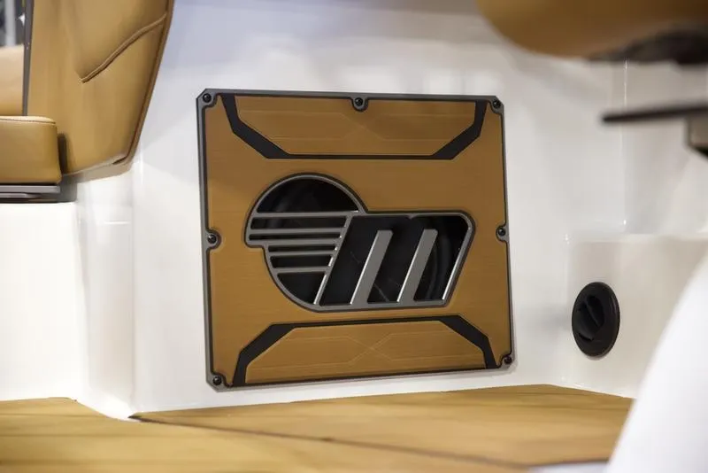 Slide: The Image of 2025 Malibu 23 LSV interior detail with stylish speaker grille design. - 14