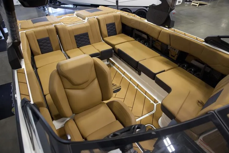 Slide: The Image of Luxurious interior of 2025 Malibu 23 LSV boat with tan leather seating. - 18