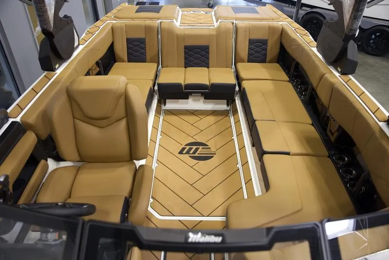 Slide: The Image of Luxurious interior of 2025 Malibu 23 LSV boat with tan leather seating. - 19
