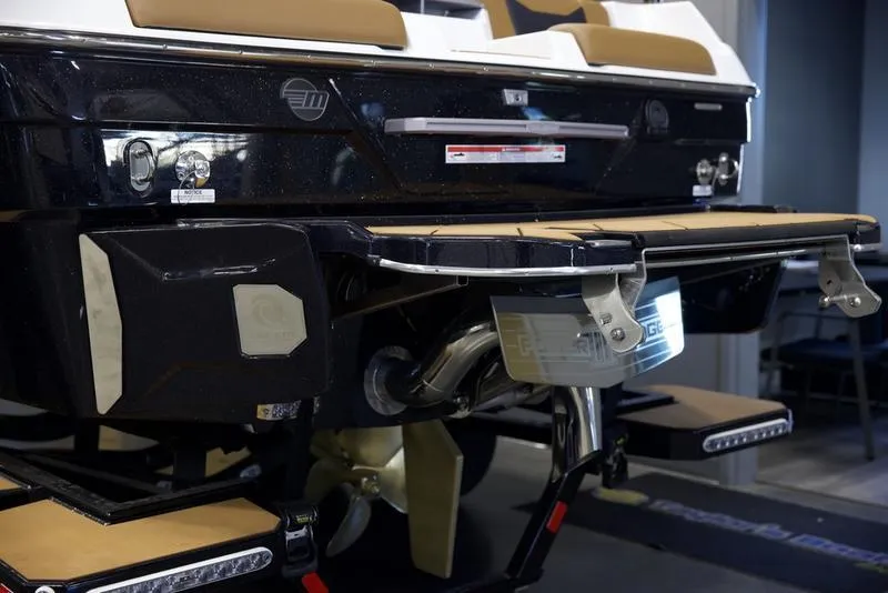 Slide: The Image of 2025 Malibu 23 LSV boat rear view with propeller and swim platform. - 4