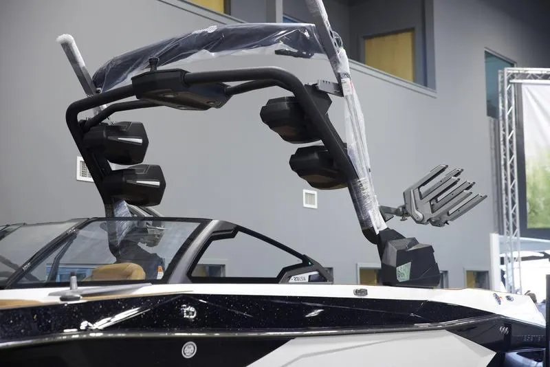 Slide: The Image of 2025 Malibu 23 LSV boat with advanced wakeboard tower and speakers. - 7