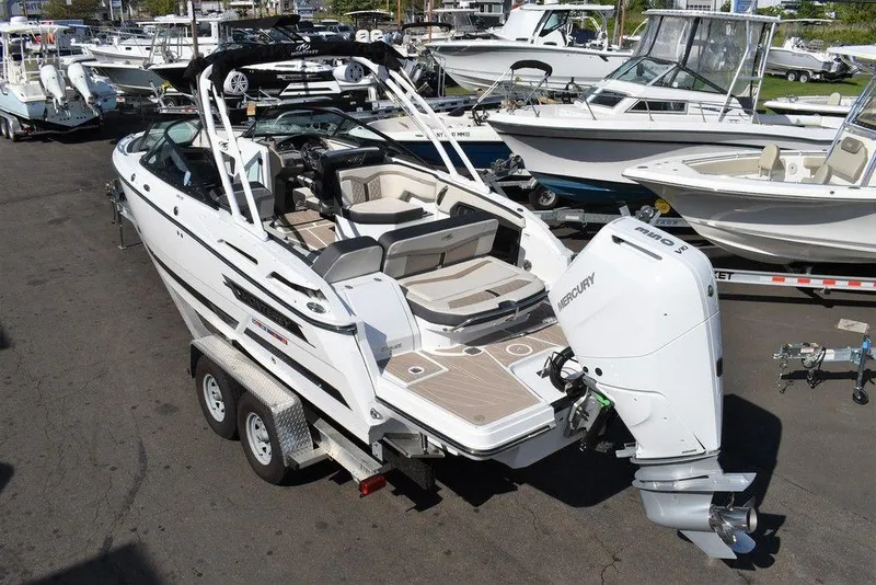 Slide: The Image of 2023 Monterey 255SS boat on trailer, featuring Mercury outboard engine. - 10