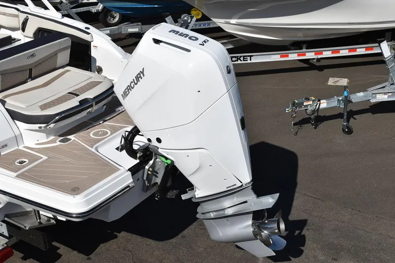 Slide: The Image of 2023 Monterey 255SS boat with Mercury outboard motor on trailer. - 12