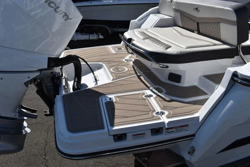 Slide: The Image of 2023 Monterey 255SS boat with spacious deck and seating area. - 15