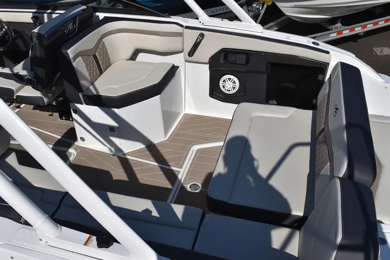Slide: The Image of Interior of 2023 Monterey 255SS boat with modern seating and sleek design. - 23