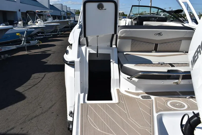 Slide: The Image of 2023 Monterey 255SS boat interior with open storage compartment and seating area. - 26