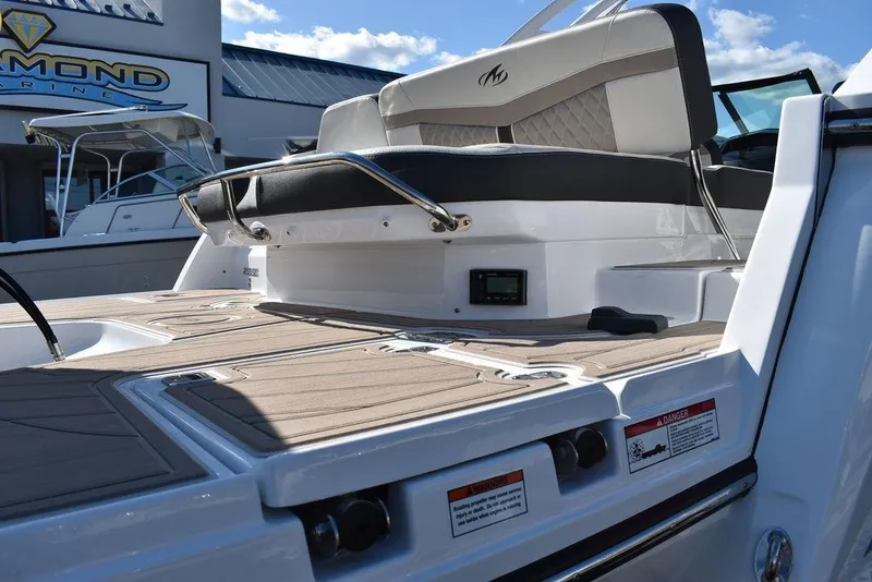 Slide: The Image of 2023 Monterey 255SS boat with sleek seating and modern design. - 27