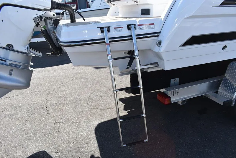 Slide: The Image of 2023 Monterey 255SS boat with extended swim platform and ladder. - 29