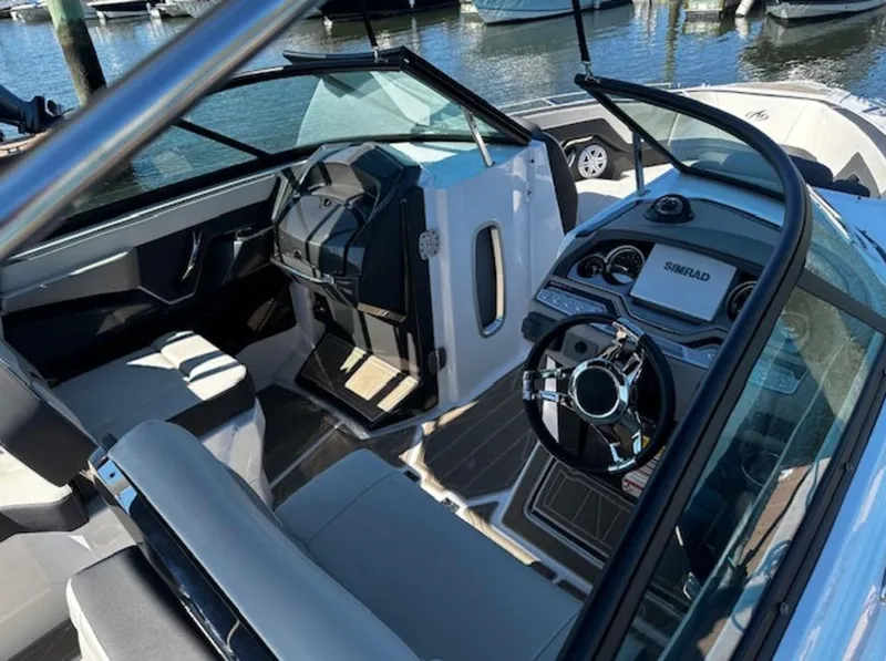 Slide: The Image of 2023 Monterey 255SS boat interior with modern dashboard and steering wheel. - 3