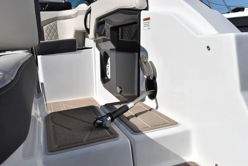 Slide: The Image of 2023 Monterey 255SS boat interior with seating and storage compartments. - 30