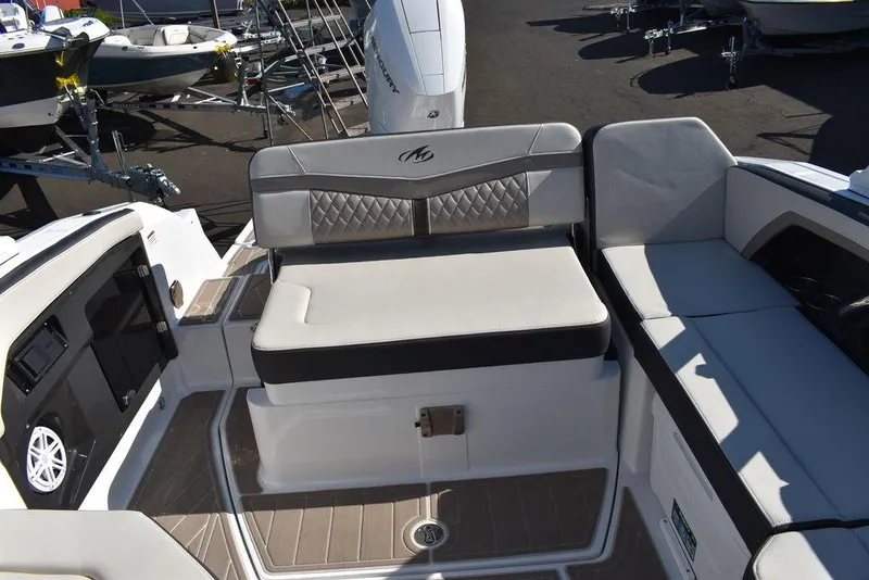 Slide: The Image of 2023 Monterey 255SS boat interior with cushioned seating and modern design. - 35