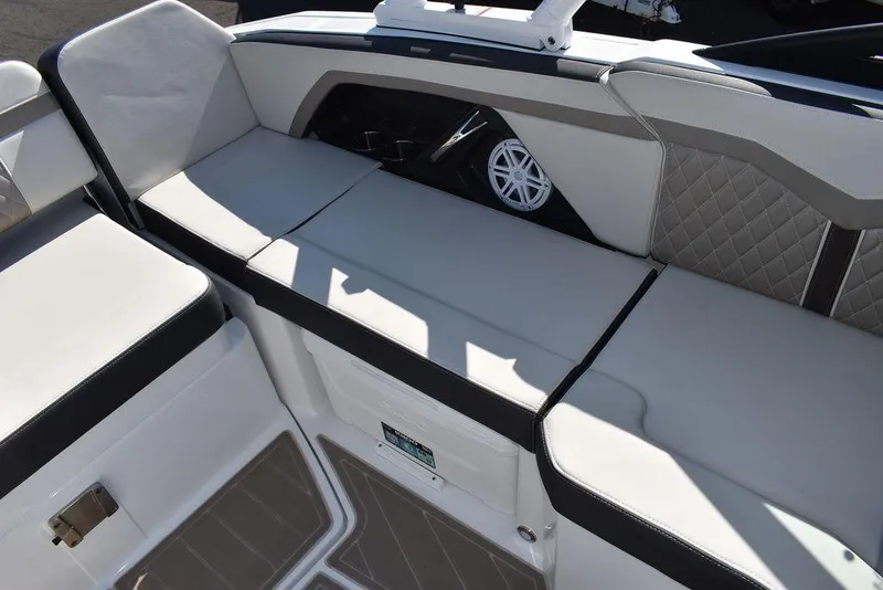 Slide: The Image of 2023 Monterey 255SS boat interior with cushioned seating and speaker. - 36