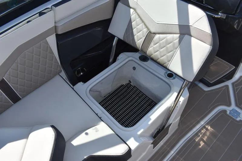 Slide: The Image of 2023 Monterey 255SS boat interior with built-in storage compartment. - 42