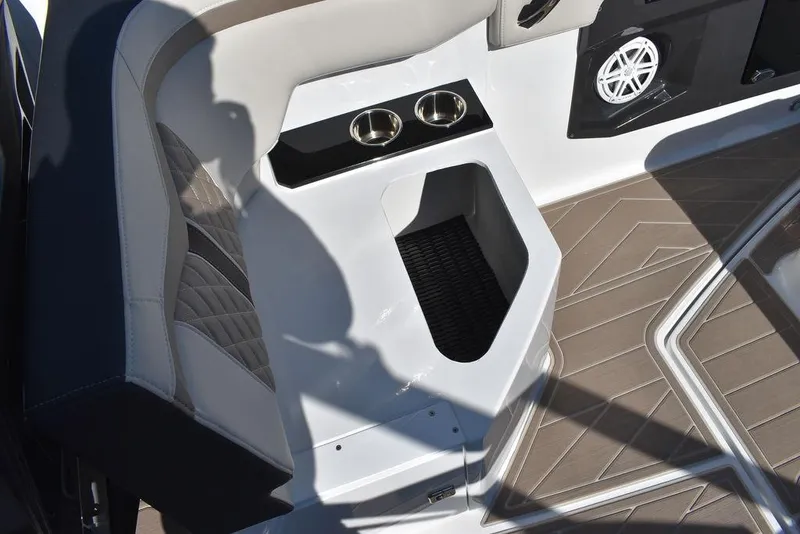 Slide: The Image of 2023 Monterey 255SS boat interior with cup holders and speaker. - 44